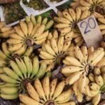 yellow banana fruit on white paper